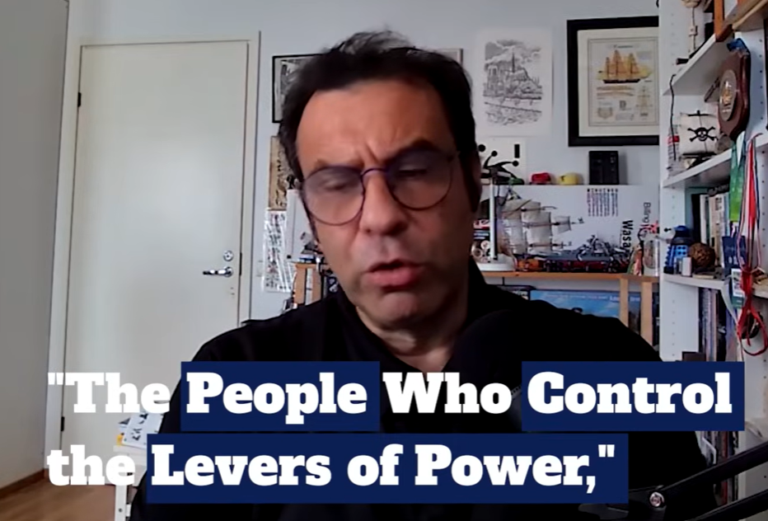 Man with glasses speaking in a home office, with on-screen text reading "The People Who Control the Levers of Power"